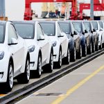 HOW CRAZY PRICES AND YEARSLONG WAIT TIMES COULD DOOM THE ELECTRIC-CAR EXPERIMENT